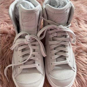 Nike Women's Blazer Mid '77 sneakers, specifically in a "triple white”